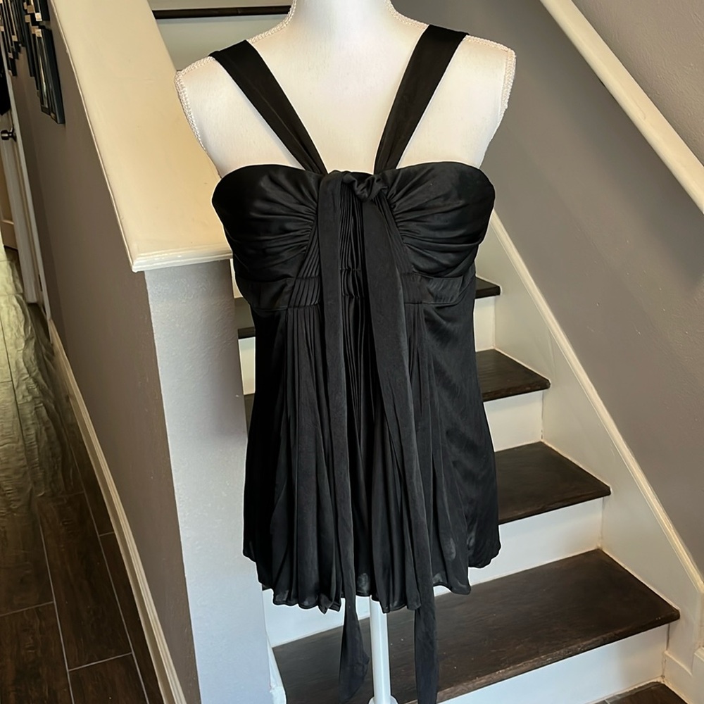 BCBG MaxAzria Beautiful Black Top never worn. Sz L Lined. Pleated center